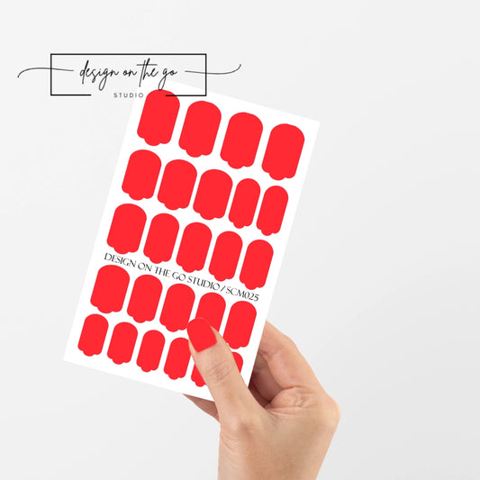 #type_manicure single hand with beautifully manicured nails with nail wraps holding full nail wraps sheet.