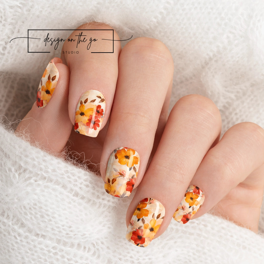 #type_manicure beautifully manicured hand showing nails with nail wraps applied on white sweater