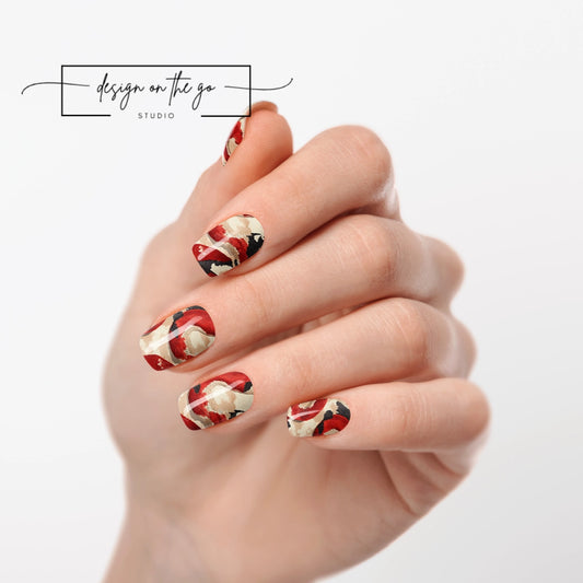 #type_manicure one hand showing beautifully manicured nail with nail wraps applied on white background
