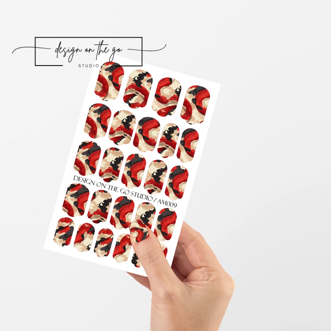 #type_manicure single hand with beautifully manicured nails with nail wraps holding full nail wraps sheet.