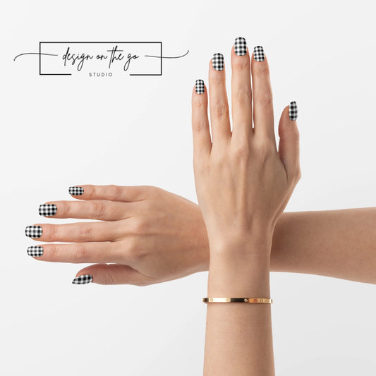 #type_manicure two hands with manicured nails that have nail wraps applied