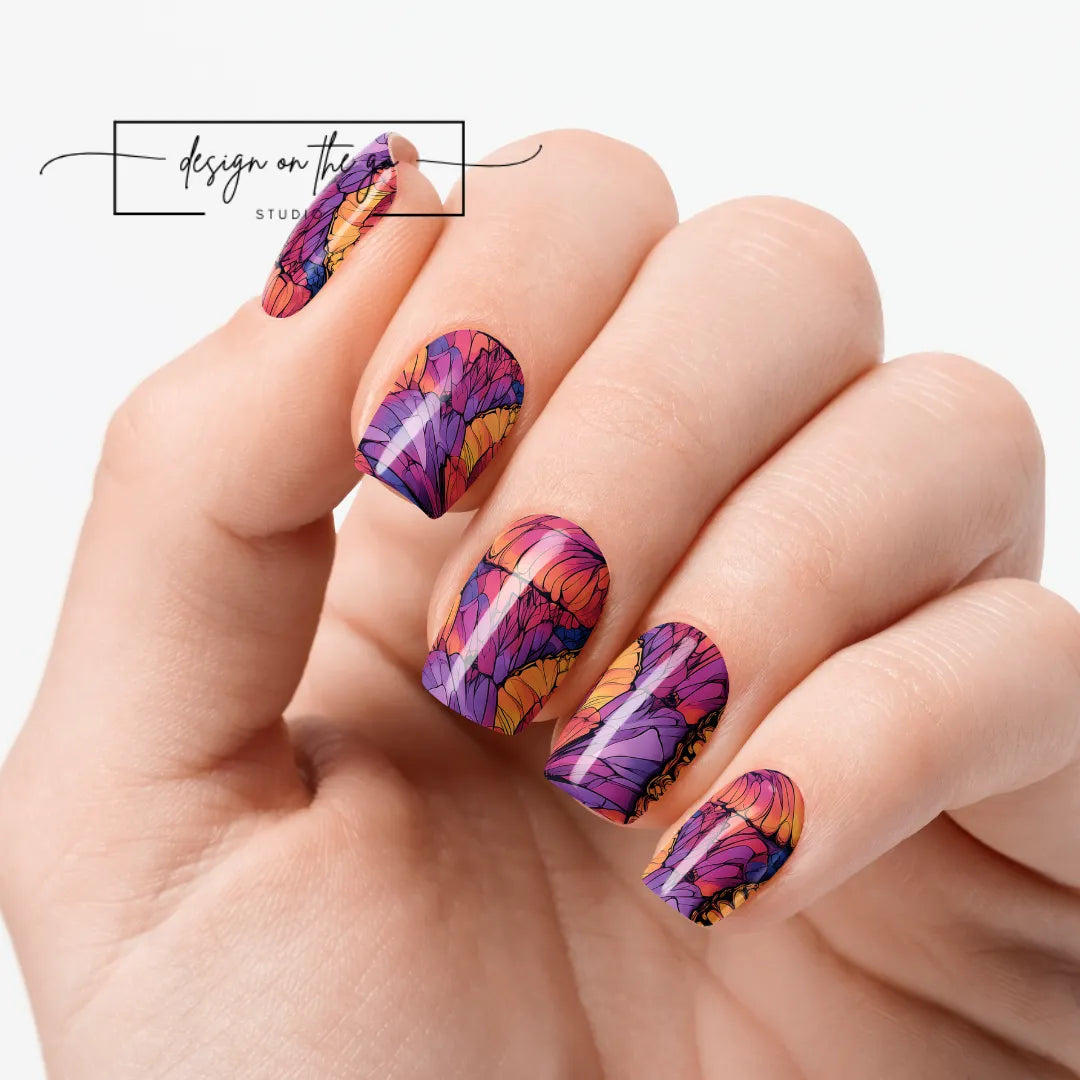 #type_manicure one hand showing beautifully manicured nail with nail wraps applied on white background