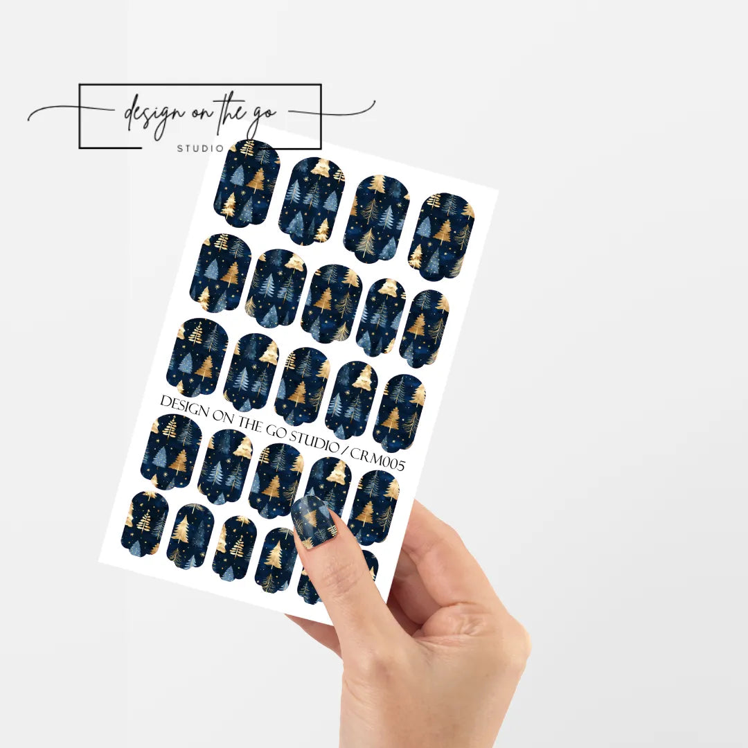 #type_manicure single hand with beautifully manicured nails with nail wraps holding full nail wraps sheet.