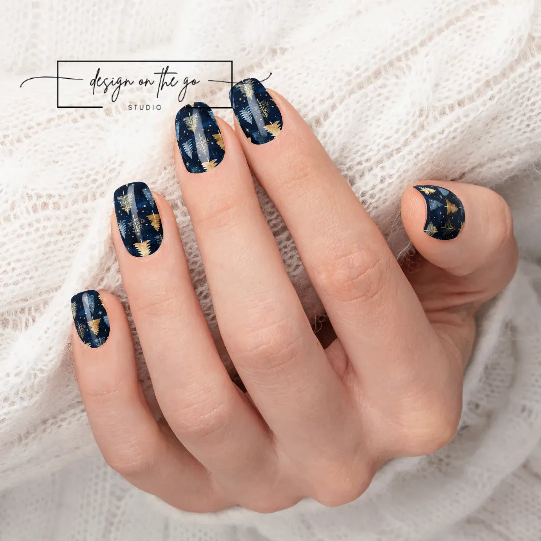 #type_manicure beautifully manicured hand showing nails with nail wraps applied on white sweater