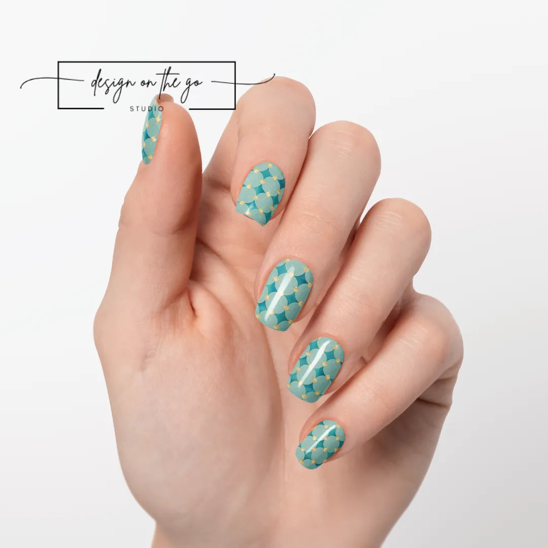 #type_manicure one hand showing beautifully manicured nail with nail wraps applied on white background