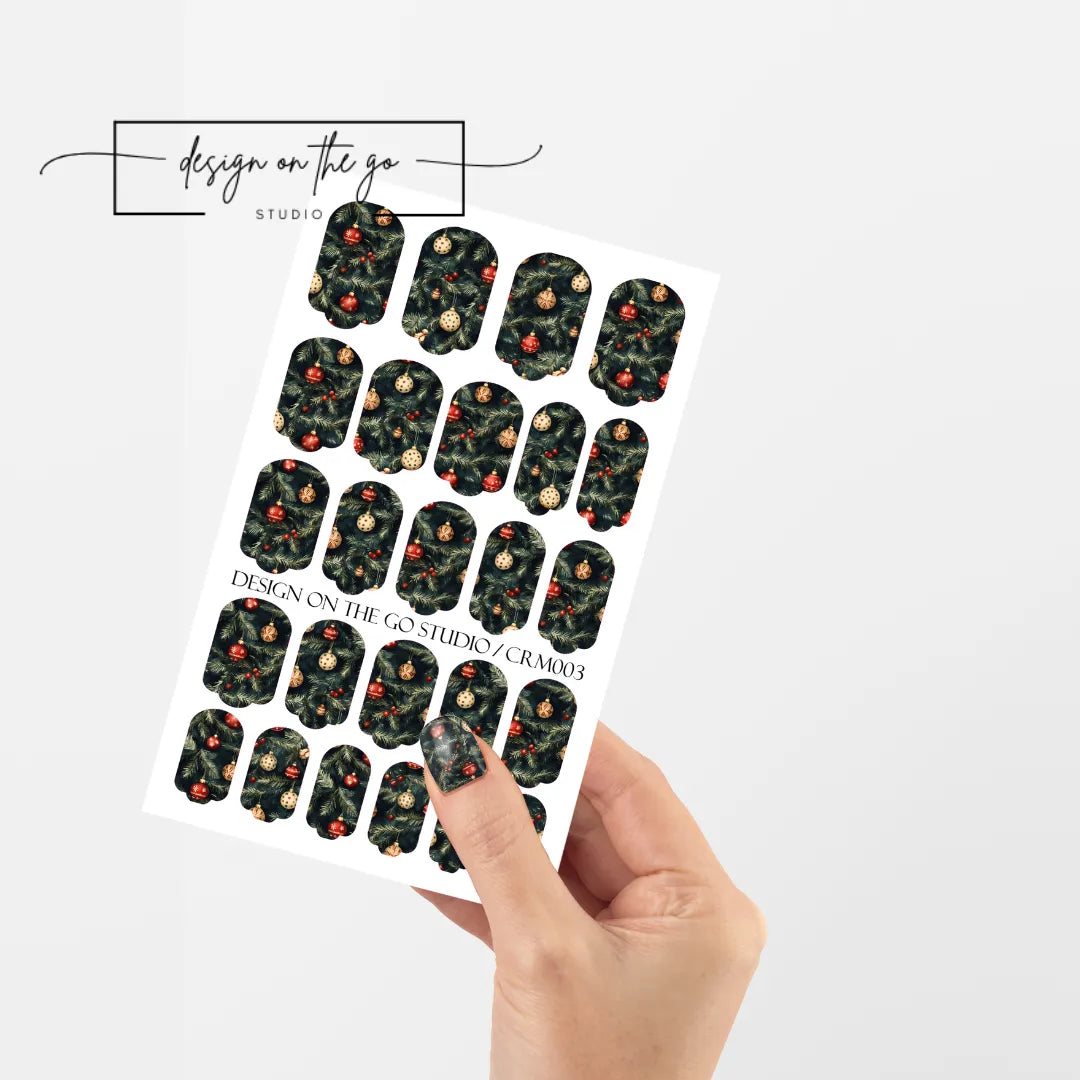 #type_manicure single hand with beautifully manicured nails with nail wraps holding full nail wraps sheet.