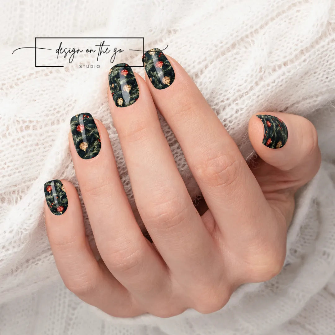 #type_manicure beautifully manicured hand showing nails with nail wraps applied on white sweater