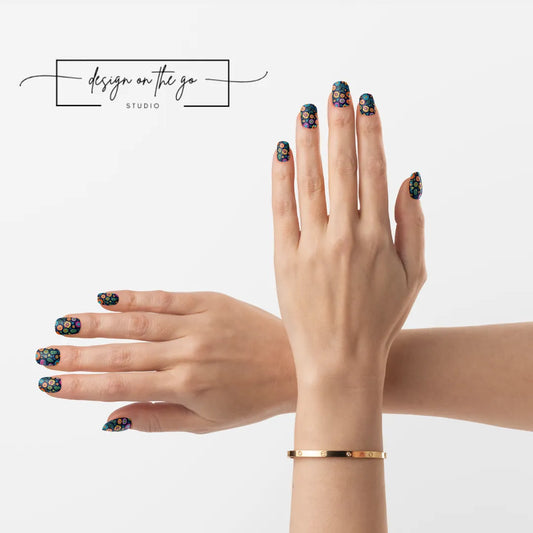 #type_manicure two hands with manicured nails that have nail wraps applied