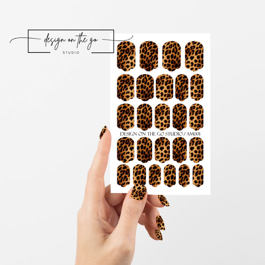 #type_manicure single hand with beautifully manicured nails with nail wraps holding full nail wraps sheet.