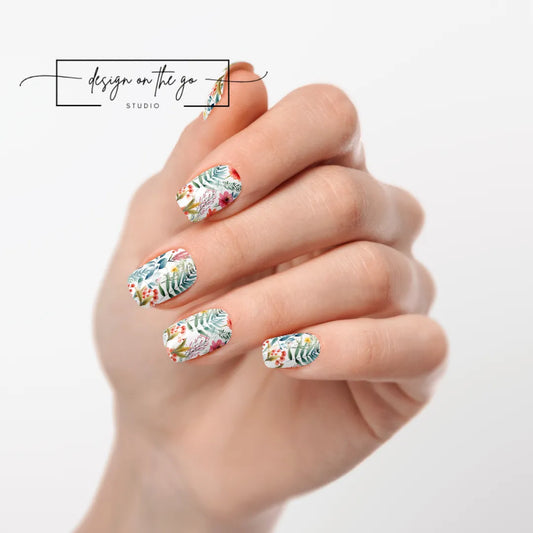 #type_manicure one hand showing beautifully manicured nail with nail wraps applied on white background