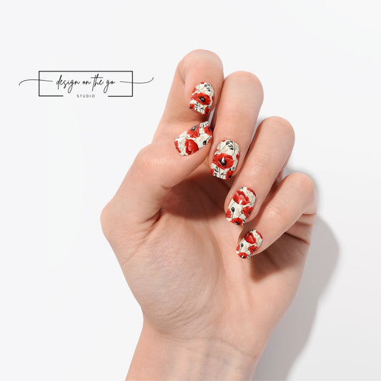 #type_manicure one hand showing beautifully manicured nail with nail wraps applied on white background