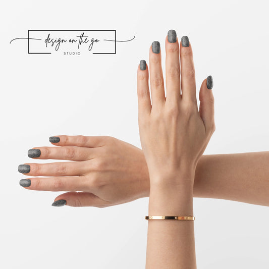 #type_manicure two hands with manicured nails that have nail wraps applied