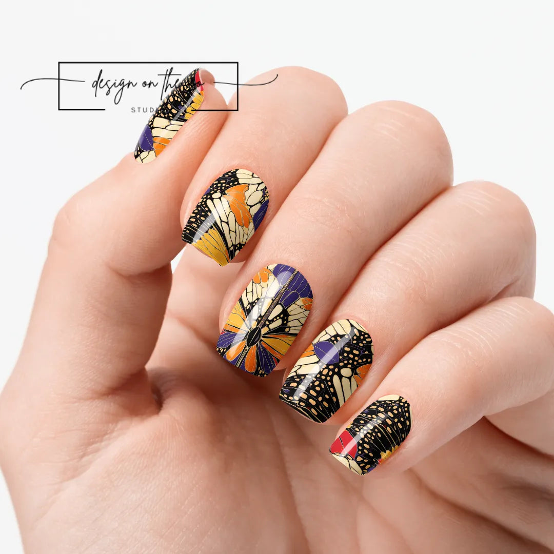 #type_manicure one hand showing beautifully manicured nail with nail wraps applied on white background
