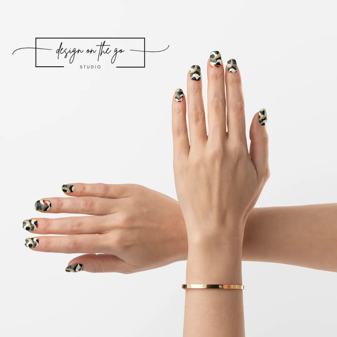 #type_manicure two hands with manicured nails that have nail wraps applied