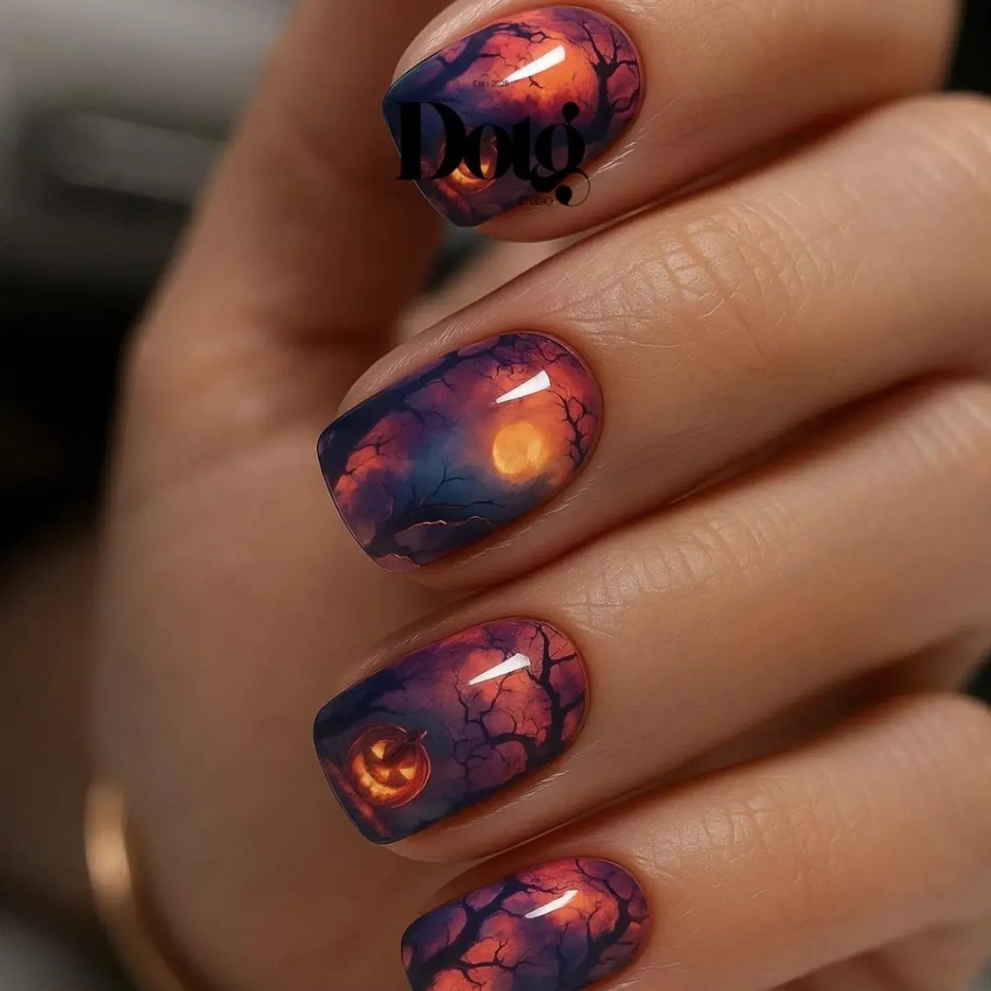 #type_manicure close up of manicured hand with Halloween theme twilight moon nail wraps