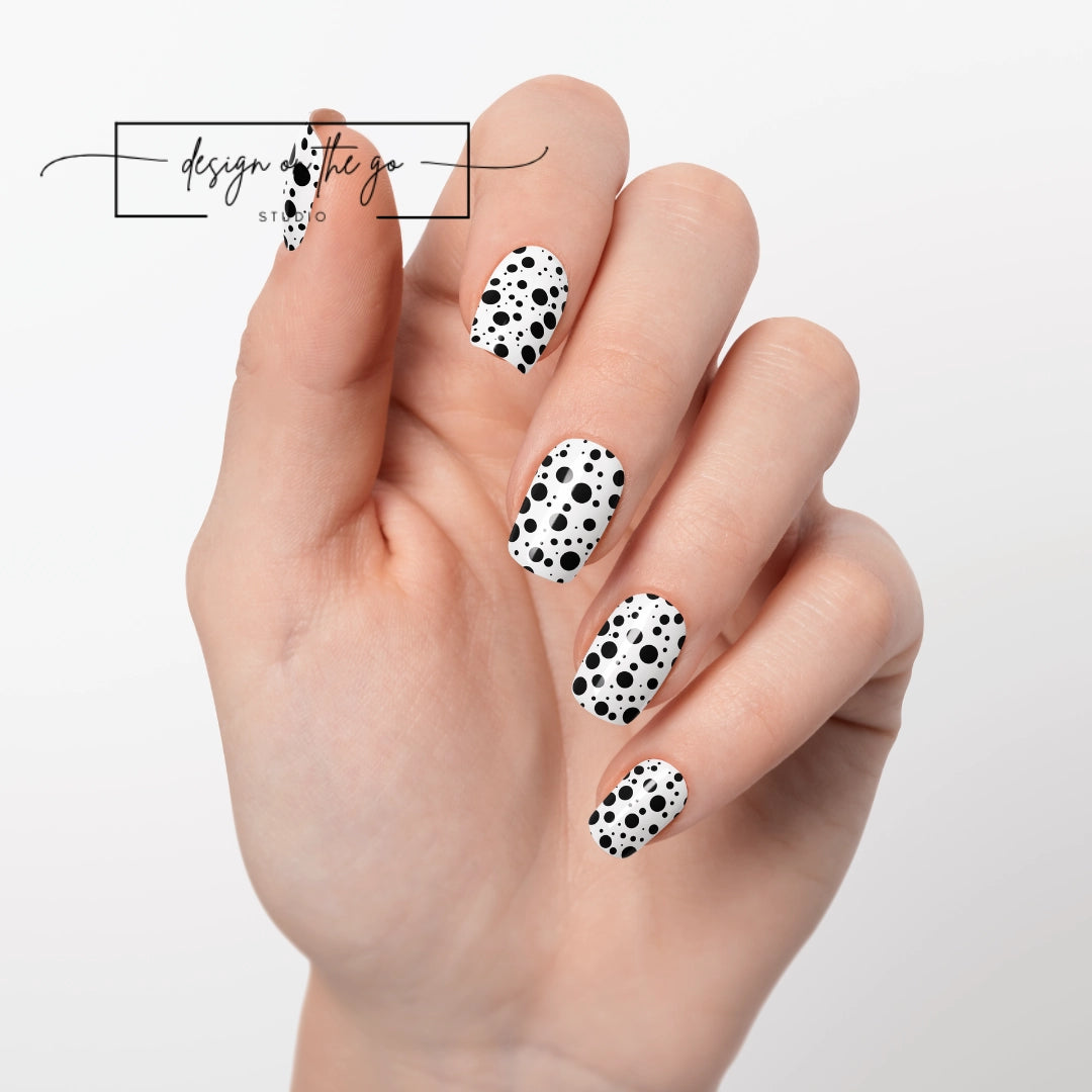 #type_manicure one hand showing beautifully manicured nail with nail wraps applied on white background