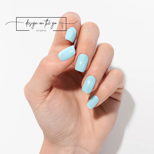 #type_manicure one hand showing beautifully manicured nail with nail wraps applied on white background