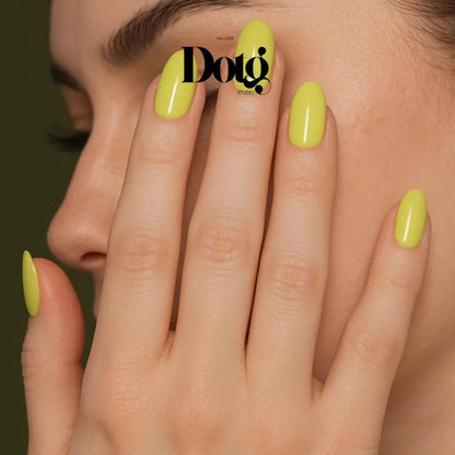 Close-up of a hand with bright green nails against a dark background, featuring the Dotg Studio brand.