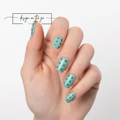 #type_manicure one hand showing beautifully manicured nail with nail wraps applied on white background