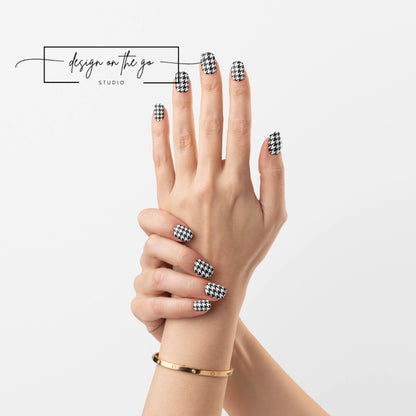 #type_manicure two hands with manicured nails that have nail wraps applied
