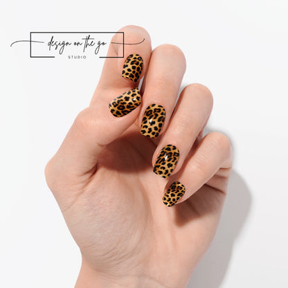 #type_manicure one hand showing beautifully manicured nail with nail wraps applied on white background