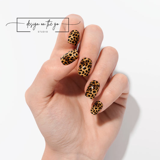 #type_manicure one hand showing beautifully manicured nail with nail wraps applied on white background