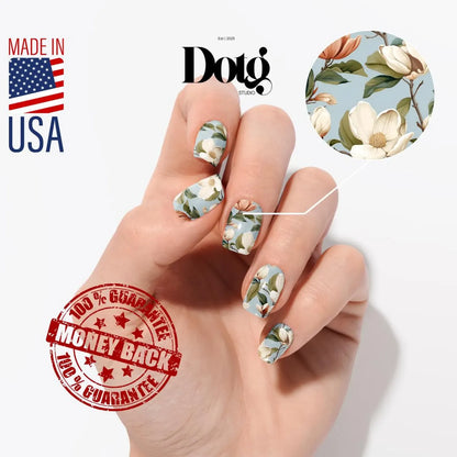 Hand with floral nail art, Dotg brand logo, Made in USA text, and money-back guarantee stamp on a white background.