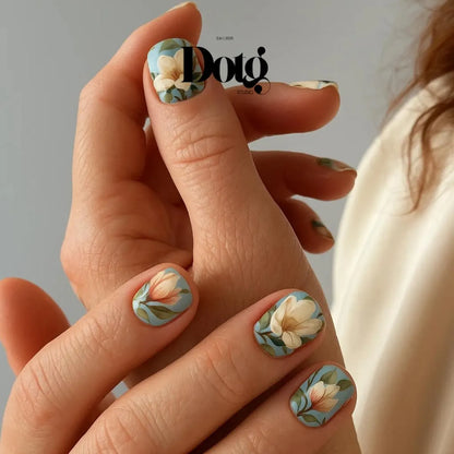 Hand with floral nail art on a neutral background