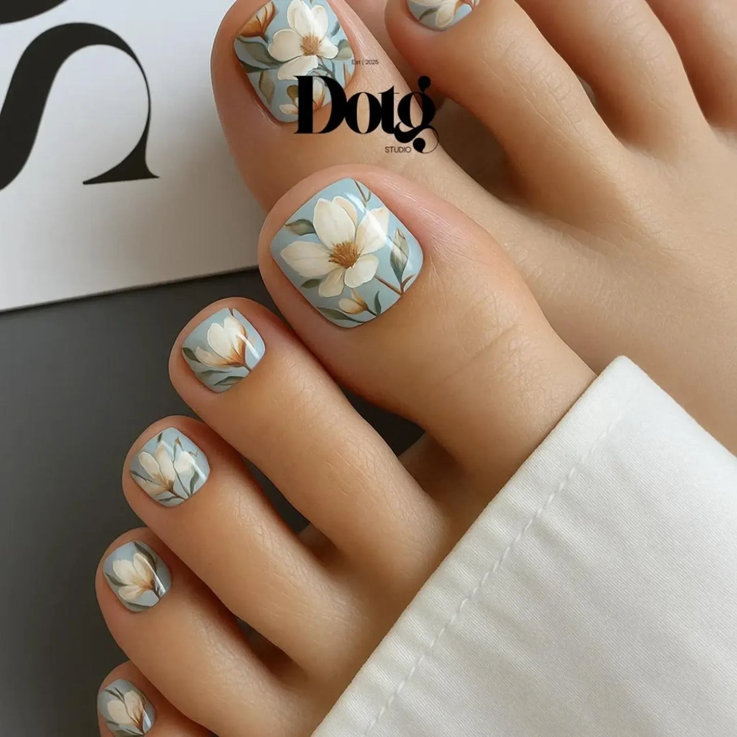 Nail wraps magnolia Nail art with floral design on toes.