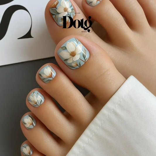 Nail wraps magnolia Nail art with floral design on toes.