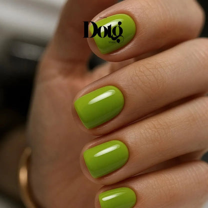 Hand with manicured fingernails with green nail wraps