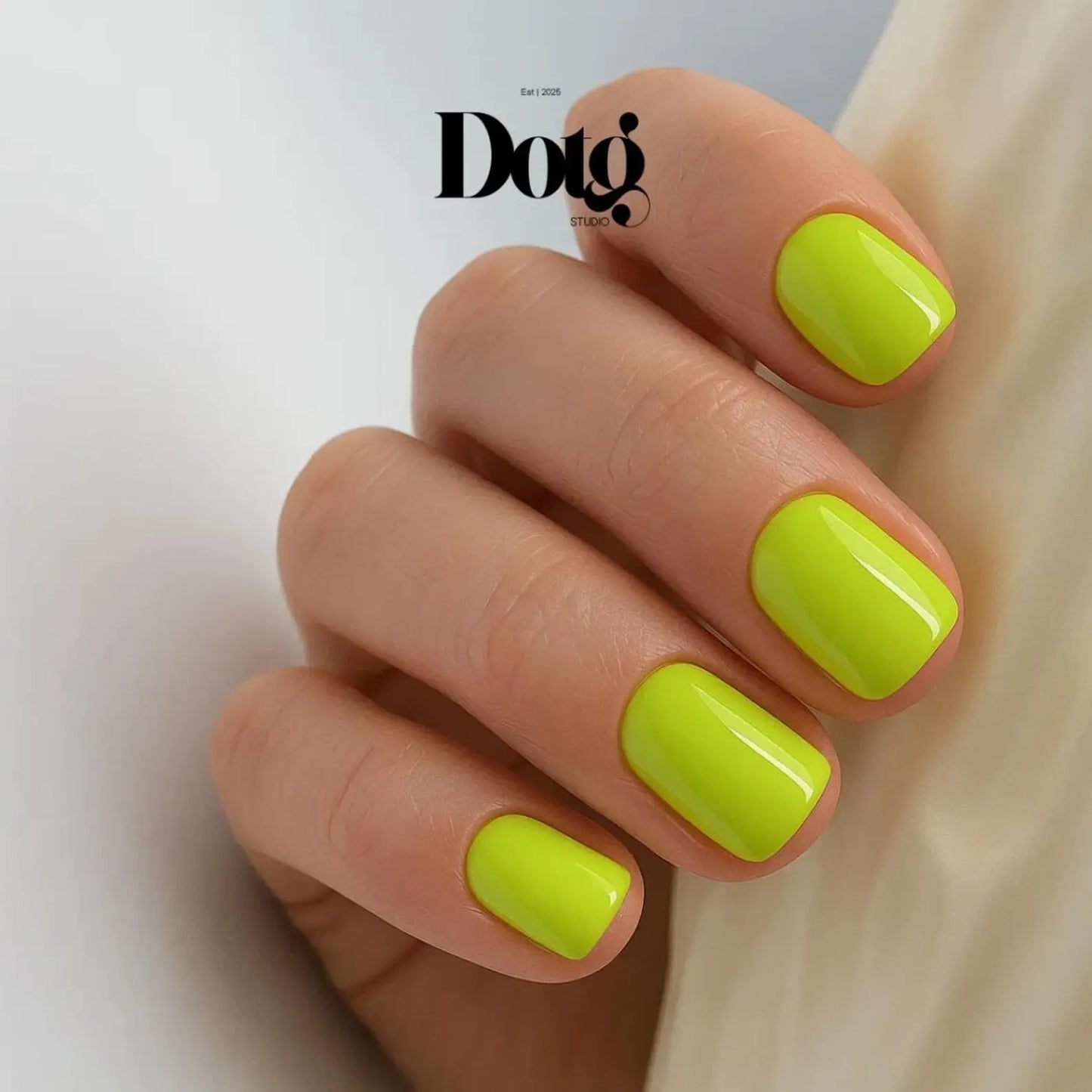 Hand with bright green nails on a light background, featuring the Doto brand.