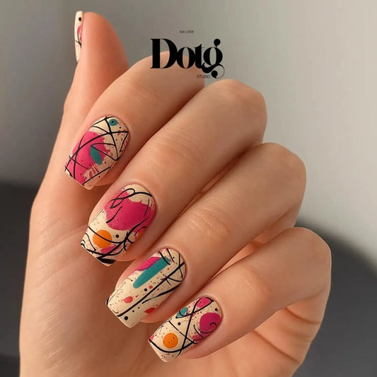 Hand with colourful nail art design on a neutral background, featuring the Dotg Studio logo.