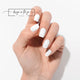 #type_manicure one hand showing beautifully manicured nail with nail wraps applied on white background
