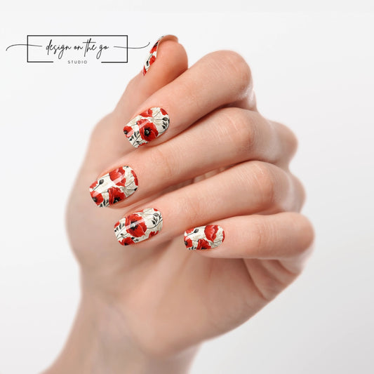 #type_manicure one hand showing beautifully manicured nail with nail wraps applied on white background