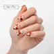 #type_manicure one hand showing beautifully manicured nail with nail wraps applied on white background