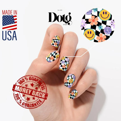 Hand with colourful nail art, Dotg Studio logo, Made in USA label, and money-back guarantee stamp on a white background.