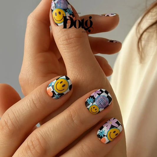 Nails with smiley face design on a neutral background