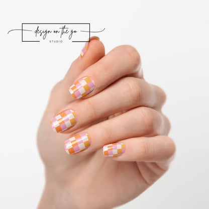#type_manicure one hand showing beautifully manicured nail with nail wraps applied on white background