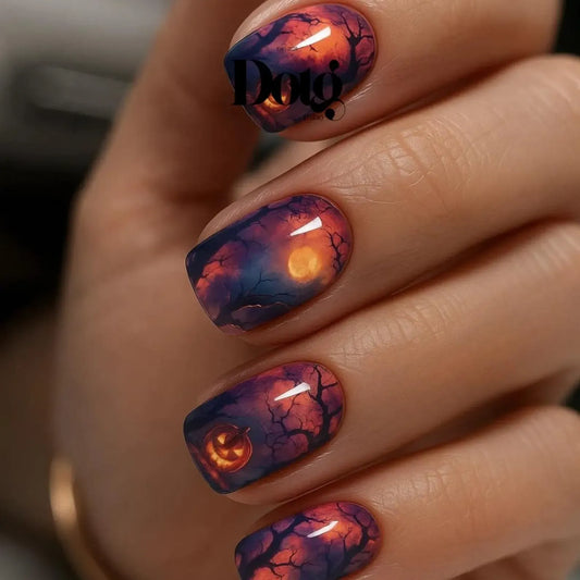 #type_manicure close up of manicured hand with Halloween theme twilight moon nail wraps